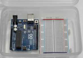 Uno and breadboard mounted inside the box
